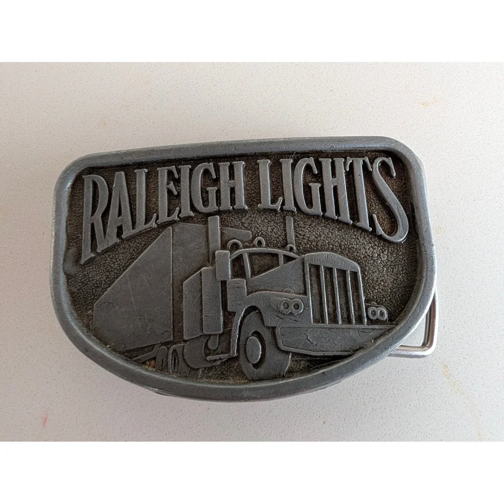 Vintage Raleigh Lights Semi Truck Belt Buckle Pewter Tone Tobacco Promo Big Rig